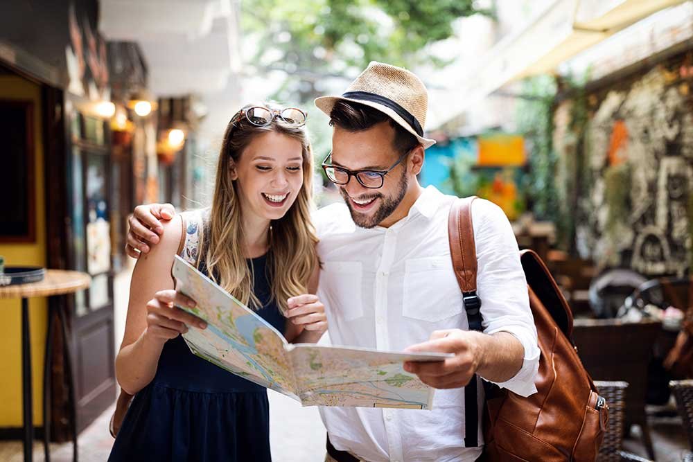 tourist-couple-traveling-travel-walking-on-street-small.jpg